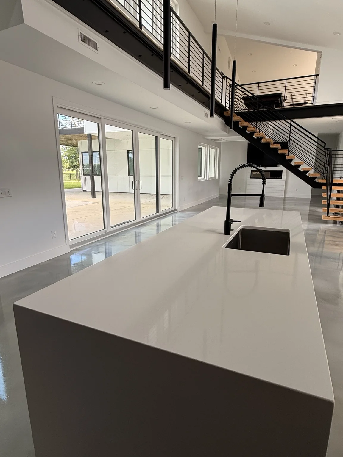 Clean modern kitchen and open-plan interior